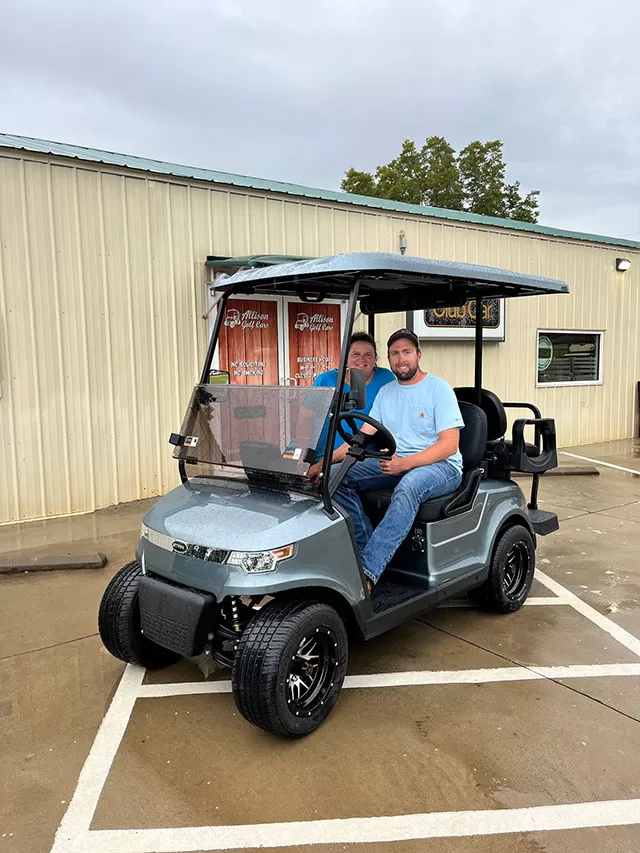 happy couple in their golf cart